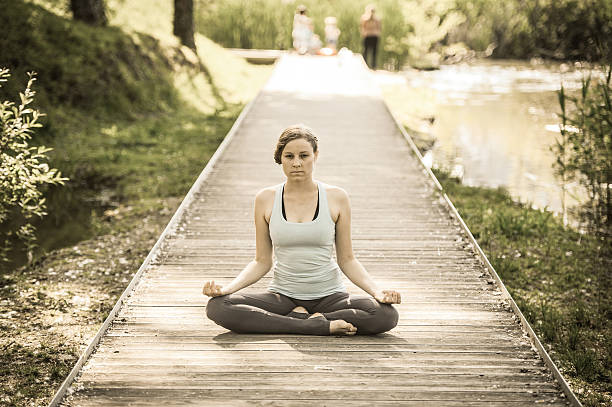 istock Woman meditating on a spring day outdoors 538447682