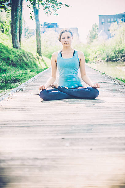 istock Woman meditating on a spring day outdoors 538448338