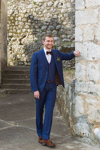 istock handsome groom in a blue suit 538449315