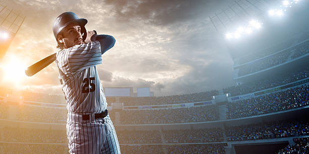 Baseball player Baseball player about to strike ball during baseball game on outdoor stadium under dramatic stormy skies. baseball hitter stock pictures, royalty-free photos & images