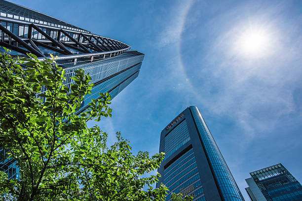 ufficio edifici di shiodome, tokyo - shimbashi district skyscraper building exterior low angle view foto e immagini stock