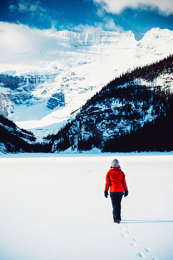 Woman Hiking on Banff National Park in Winter. Canada