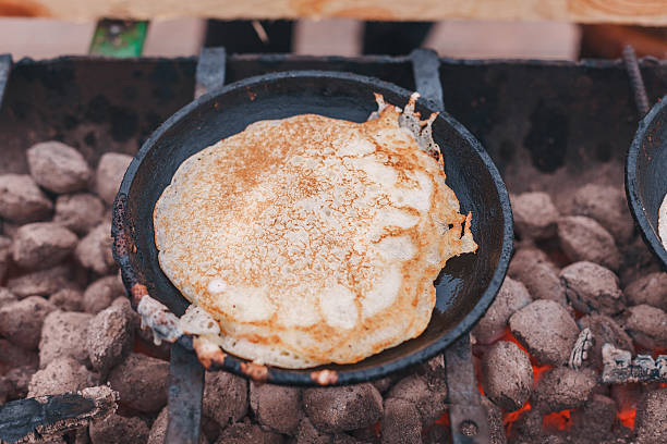 istock The pancakes are fried in a pan on the coals 538451640