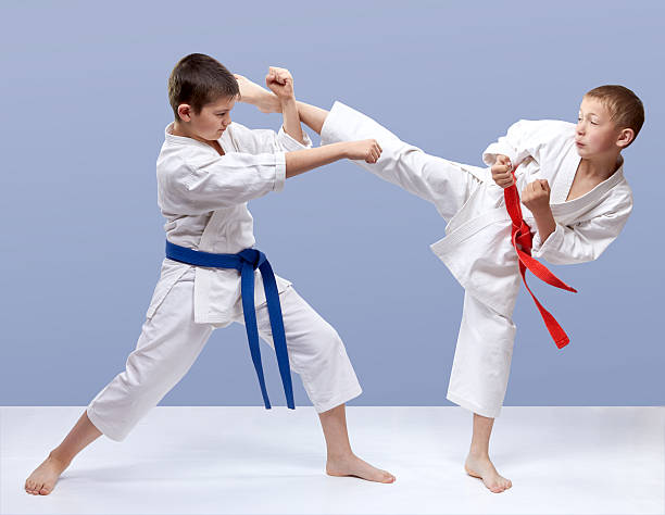 istock On gray background boys are beating blows arm and leg 538452030