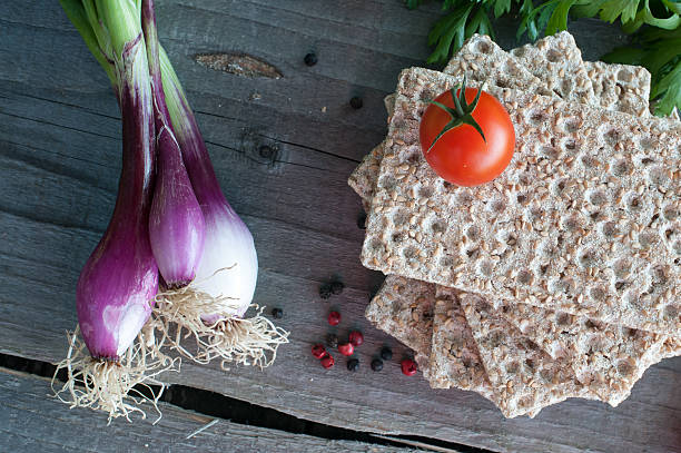 istock Vegetables and crisp bread on wooden table 538452593