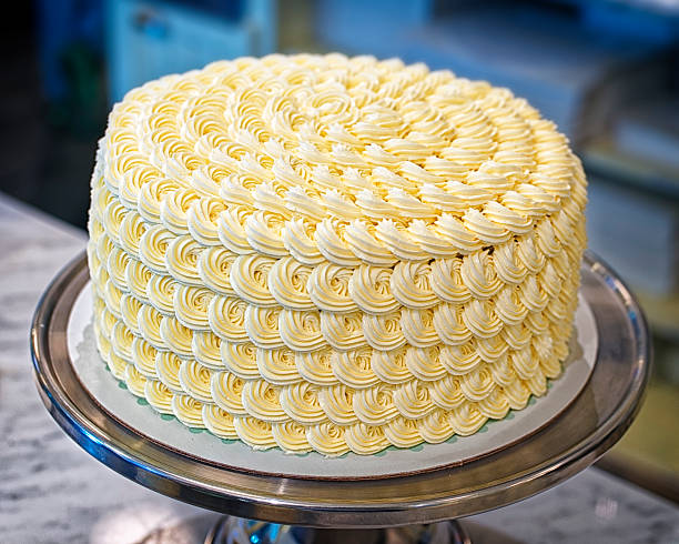 Round creamy cake on the bakery storefront