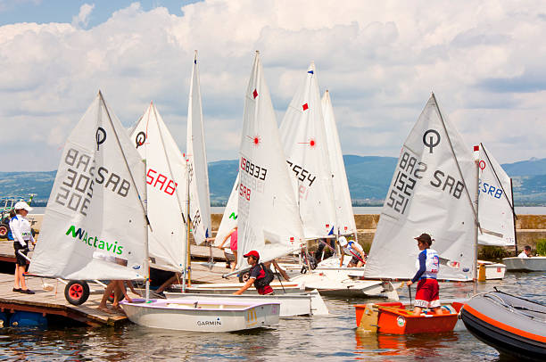 Golubac, Serbia - June 05, 2016: The end of the race in Golubac regatta. The kids are docking their boats and getting them out of the river Danube