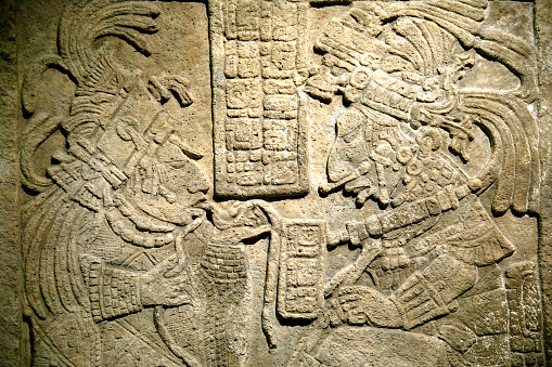 Ancient Maya limestone lintel from Yachilan, Mexico dating from about AD725. The scene is of a blood-letting ritual.