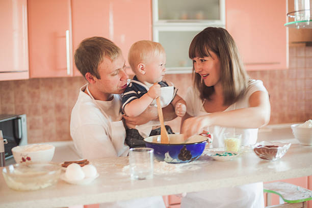 istock Happy family cooking at kitchen 538455097