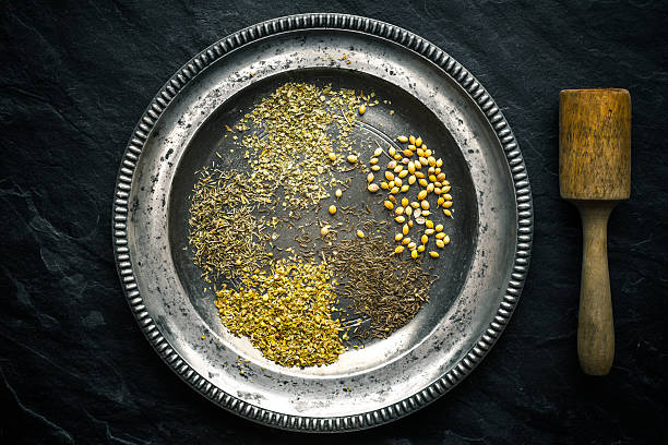 set of gyros spices on a tin plate and pestle - mortar and pestle spice seasoning coriander seed imagens e fotografias de stock