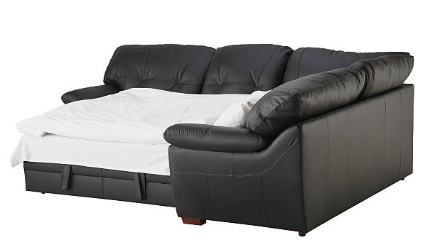 istock Black brown leather corner couch bed isolated on white 538460122