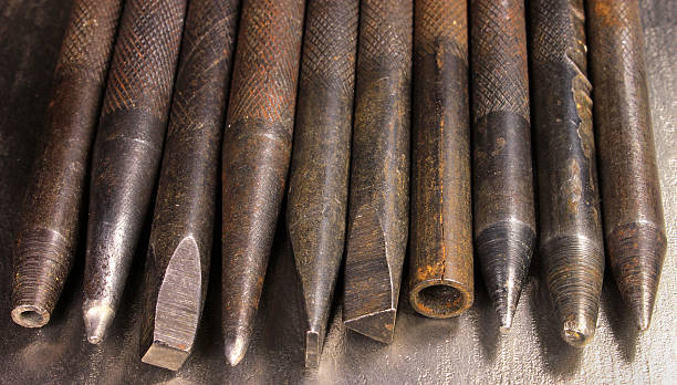 Old rusty hand iron punchers and chisels Old rusty hand iron punchers and chisels knurl stock pictures, royalty-free photos & images