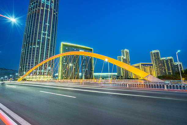 istock motion blurred car at bridge,tianjin city 538461176