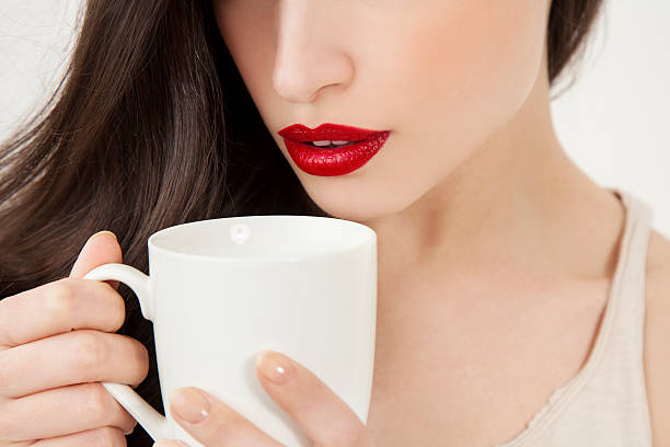 istock young woman holding a white cup 538461206