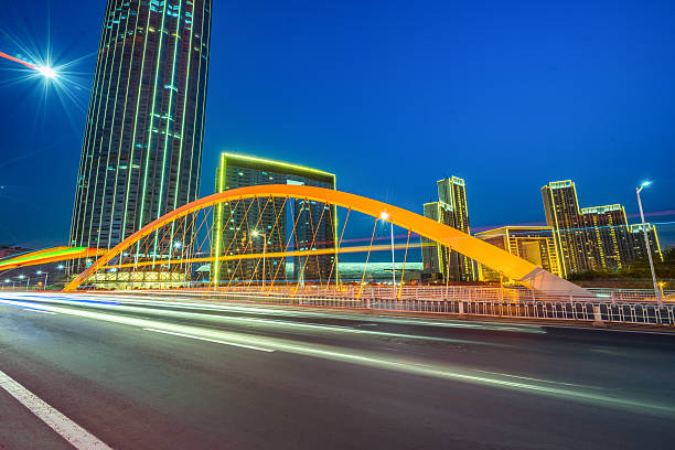 istock motion blurred car at bridge,tianjin city 538461354