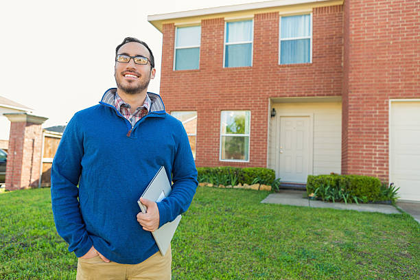 istock First time homeowner in front of new house 538462282