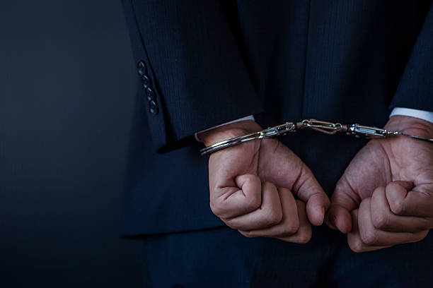 istock Hands of businessman in handcuffs 538463400