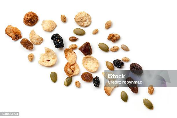 Granola Scattered Over White Top View Stock Photo - Download Image Now - Cereal Plant, Exploding, Breakfast Cereal