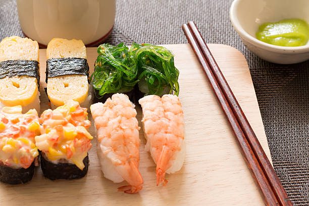 istock Sushi set chop sticks soy sauce served on wooden slate 538466816