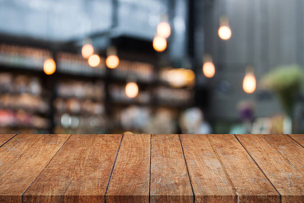 istock Perspective table top wooden with blurred cafe background 538466906