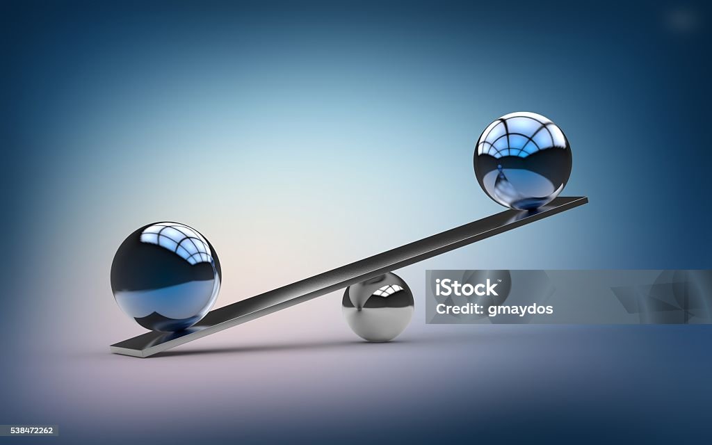 Metallic Blue Orbs Balancing on Small Silver Ball Metal Beam Metallic Blue Orbs Balancing on Small Silver Ball and Metal Beam. Reflections inside balance balls on metal balance beam. Blue, pink color gradient background. Copy space. Scales concept.  Imbalance Stock Photo