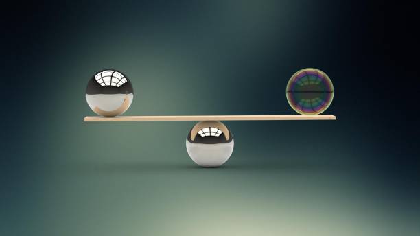 istock Bubble balancing a metal ball - weight scale balanced 538473994