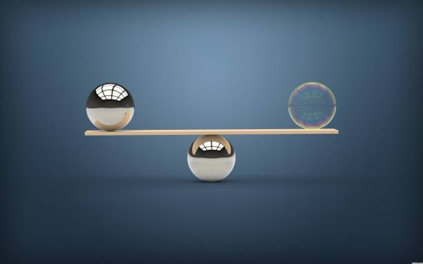 istock Equilibrium -Bubble with reflection balancing a metal ball blue background 538474482