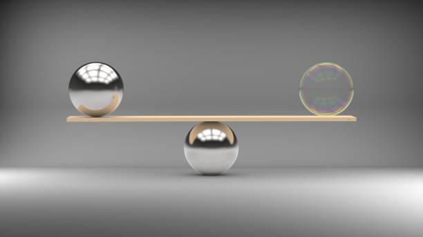 istock Balancing transparent and metal balls on silver background 538475090