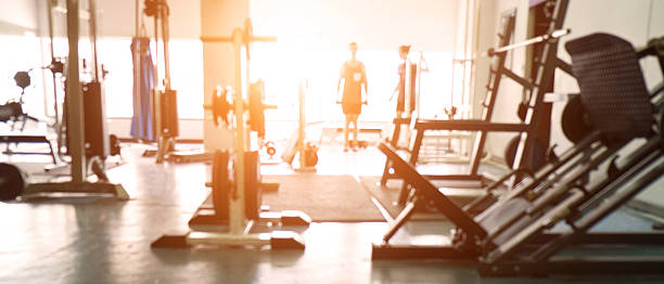 Blurred background of gym. Blurred of fitness gym background for banner presentation. exercise equipment stock pictures, royalty-free photos & images