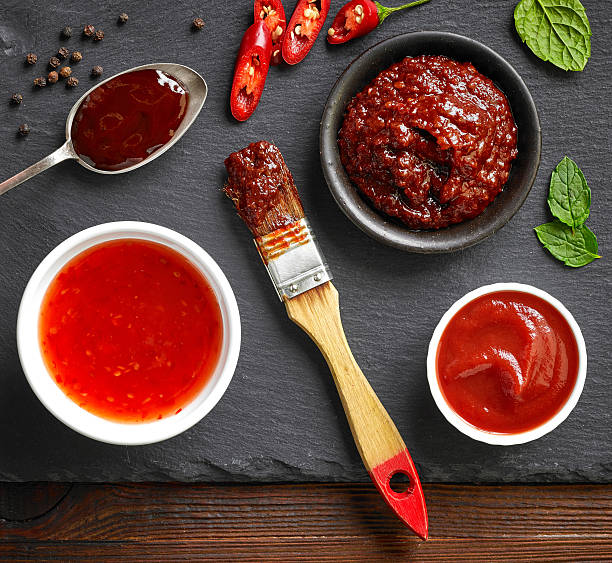 cuencos de varias salsas - marinated fotografías e imágenes de stock
