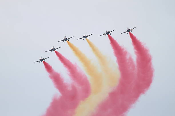 Eagle Patrol Rome, Italy - June 29, 2014: The spanish acrobatic team Patrulla Aguila perform at the Rome International Air Show on June 29, 2014 in Rome, Italy aerobatics photos stock pictures, royalty-free photos & images