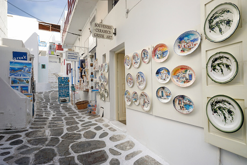 Mykonos Town, Greece - September 25, 2008:  Mykonos is one of the famous island with lot s of tourist in the Mediterranean sea. Street and souvenir shop can be found around the white colour building, tiny streets and whitewashed steps