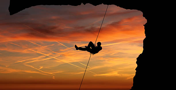 istock Silhouette of a climber over beautiful sunset 538478052