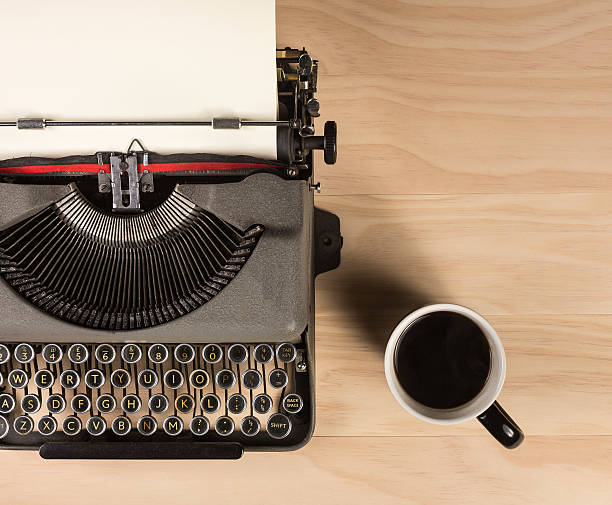 istock vintage typewriter with a cup of coffee 538478508
