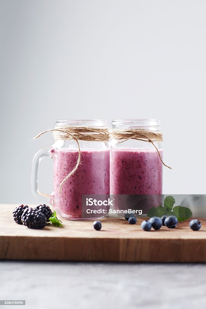 Jars of fresh homemade fruit smoothie,  studio 2015 Stock Photo