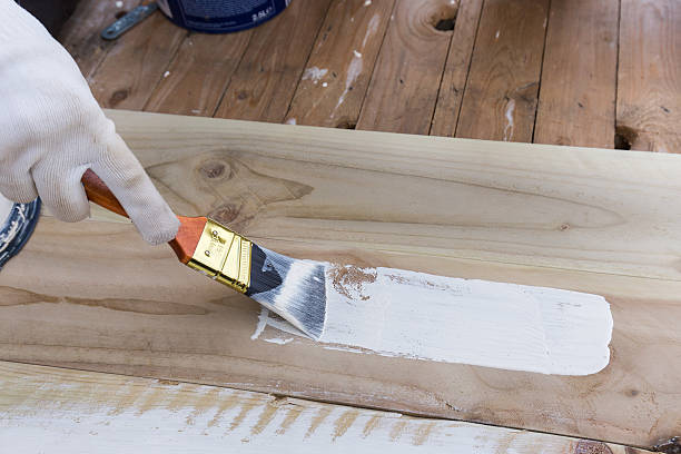 istock Painting timber boards with the white paint. 538479218