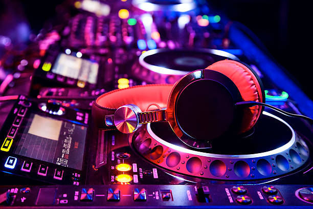 Dj mixer with headphones Dj mixer with headphones at nightclub dj stock pictures, royalty-free photos & images