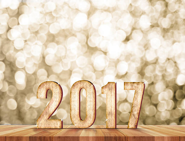 istock 2017 year wood number in perspective room with sparkling bokeh 538479886