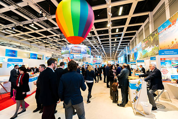 ITB Berlin 2016 Berlin, Germany - March 10, 2016: Various exhibitor booths seen during the ITB Berlin 2016, one of Germany's biggest travel fairs held in Messe Berlin in Berlin, Germany. Visitors can be seen walking around the aisles. tradeshow photos stock pictures, royalty-free photos & images
