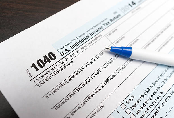 istock 1040 Individual tax return form close up with pen 538481001