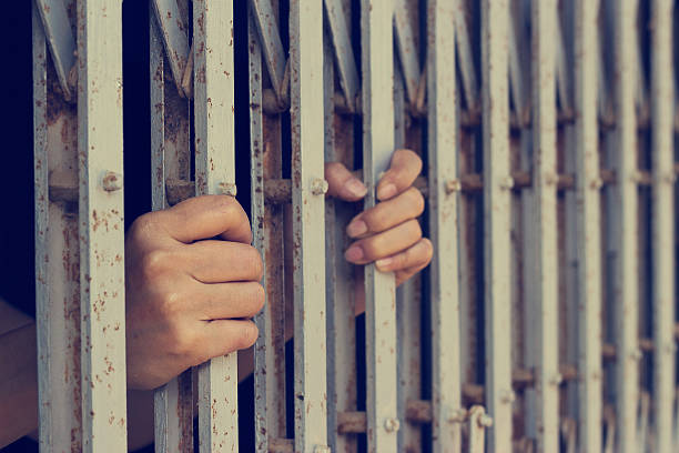 istock hands of woman who was imprisoned 538481720