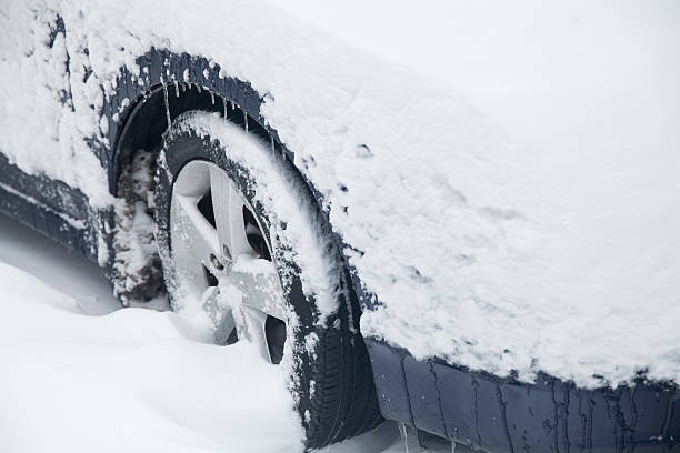 istock Car tires stuck in snow 538482093