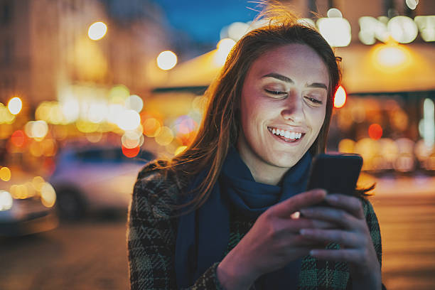 istock Young woman texting at night 538483950