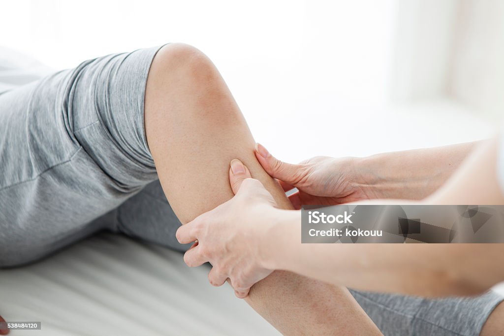 Women have been massaging the foot in the gym Massaging Stock Photo