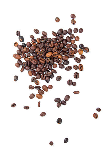 istock Roasted coffee beans spilled on a white background. 538486110