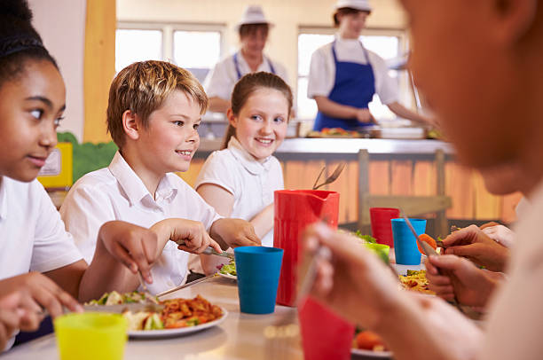 istock Primary school kids at a table in school cafeteria, close up 538486582