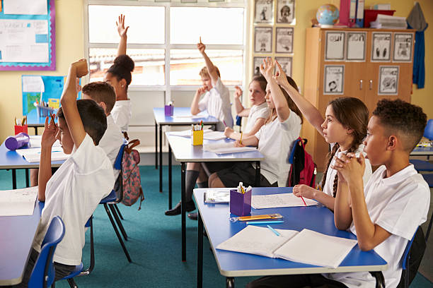 istock Pupils raise hands in a lesson at primary school, 538486828