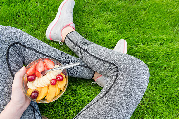 istock Young girl eating a fruit salad after a workout . 538487680