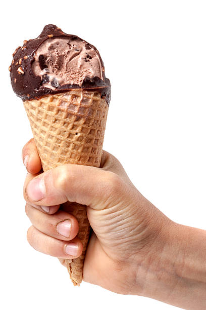 istock child' hand holding bitten off ice cream isolated on white 538488472
