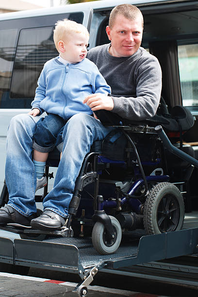 istock Disabled Men with son on Wheelchair Lift 538488790
